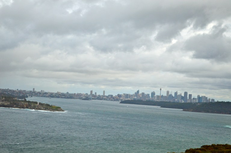 The weather was not in our favor, but on a clearer day you could better see the outline of the city between the Manly Beach cliffs. 
