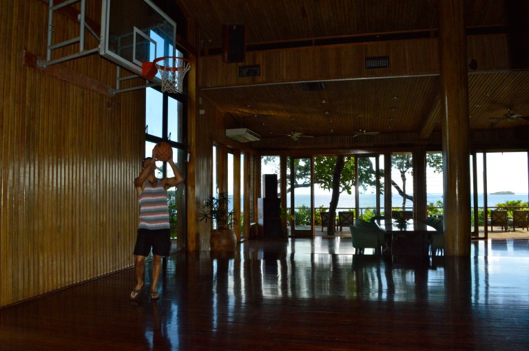 Sean shooting hoops in the entertainment center. Notice the scenery through the windows. 
